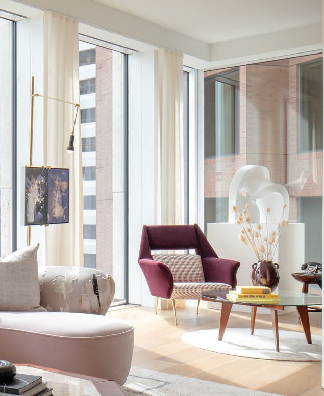 A velvet chair for Minotti in front of a Gio Ponti walnut and glass coffee table PHOTO BY SCOTT HARGIS