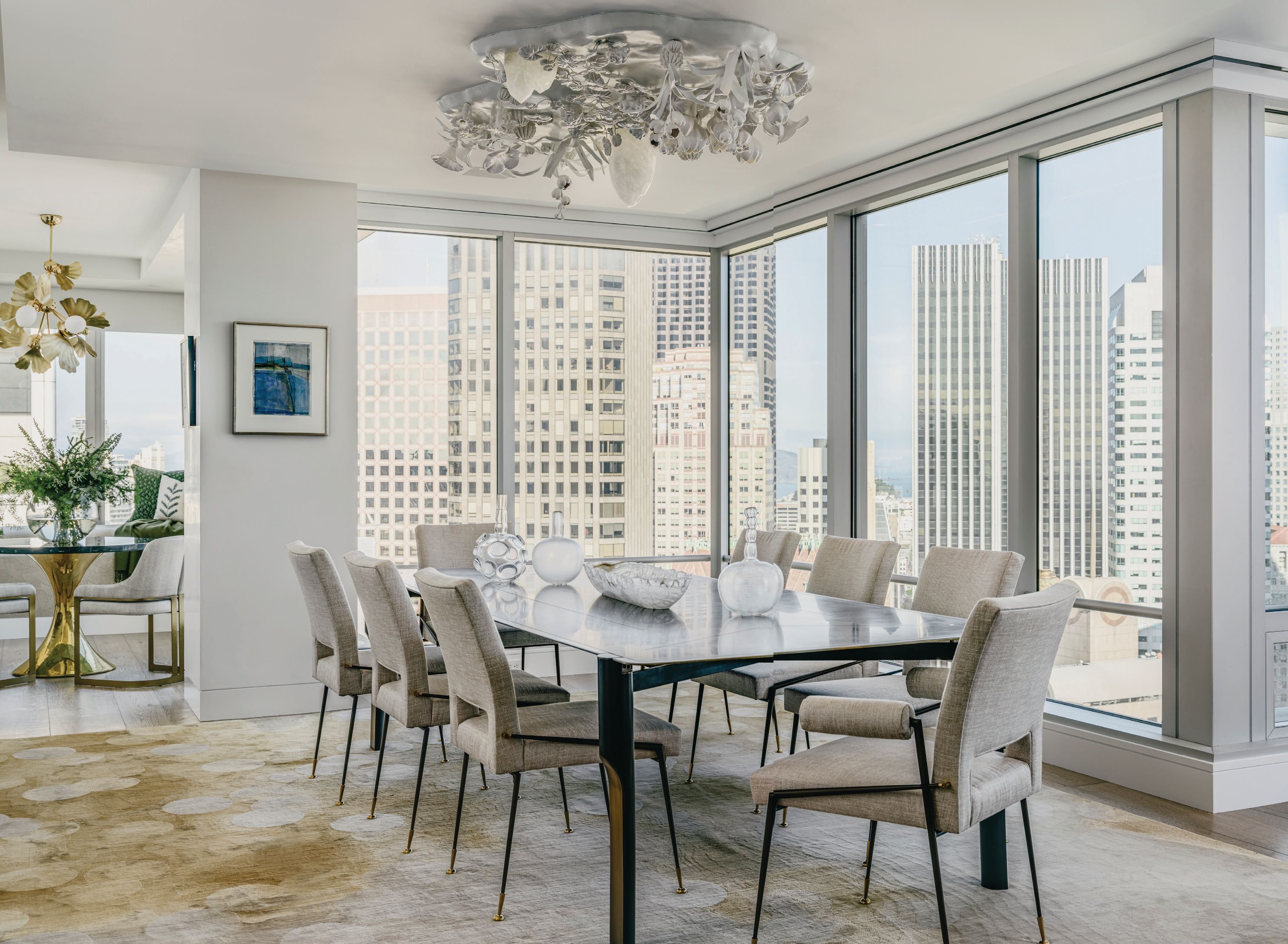 David Wiseman Cloud Garden Canopy lighting sets the stage for a gorgeous dining room with exceptional views of the city. PHOTOGRAPHED BY CHRISTOPHER STARK