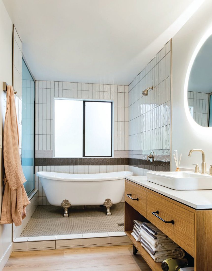The Spa Cottage boasts a luxe clawfoot tub along with a stocked apothecary medicine cabinet for the ultimate wellness retreat. PHOTO BY: CODI ANN BACKMAN