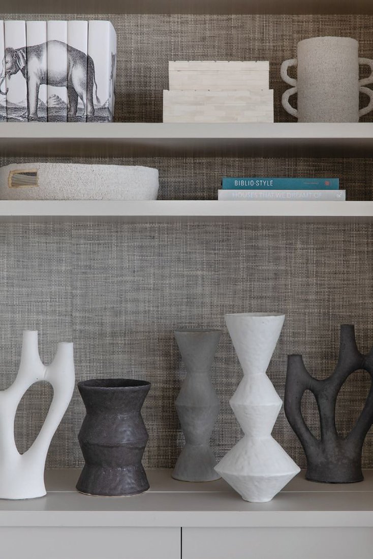 Mixedmedia pieces line the shelves, adding visual flair to the room. PHOTOGRAPHED BY BESS FRIDAY