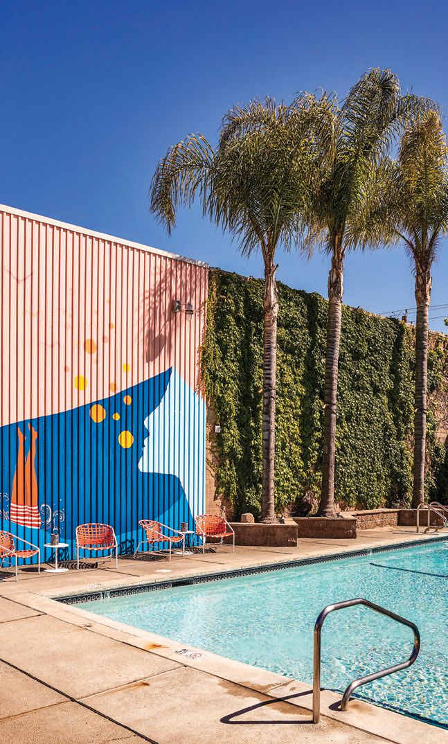 A vibrant mural by San Francisco-based Truth to Paper (@truthtopaper) covers a wall by the pool PHOTO BY: KATIE NEWBURN