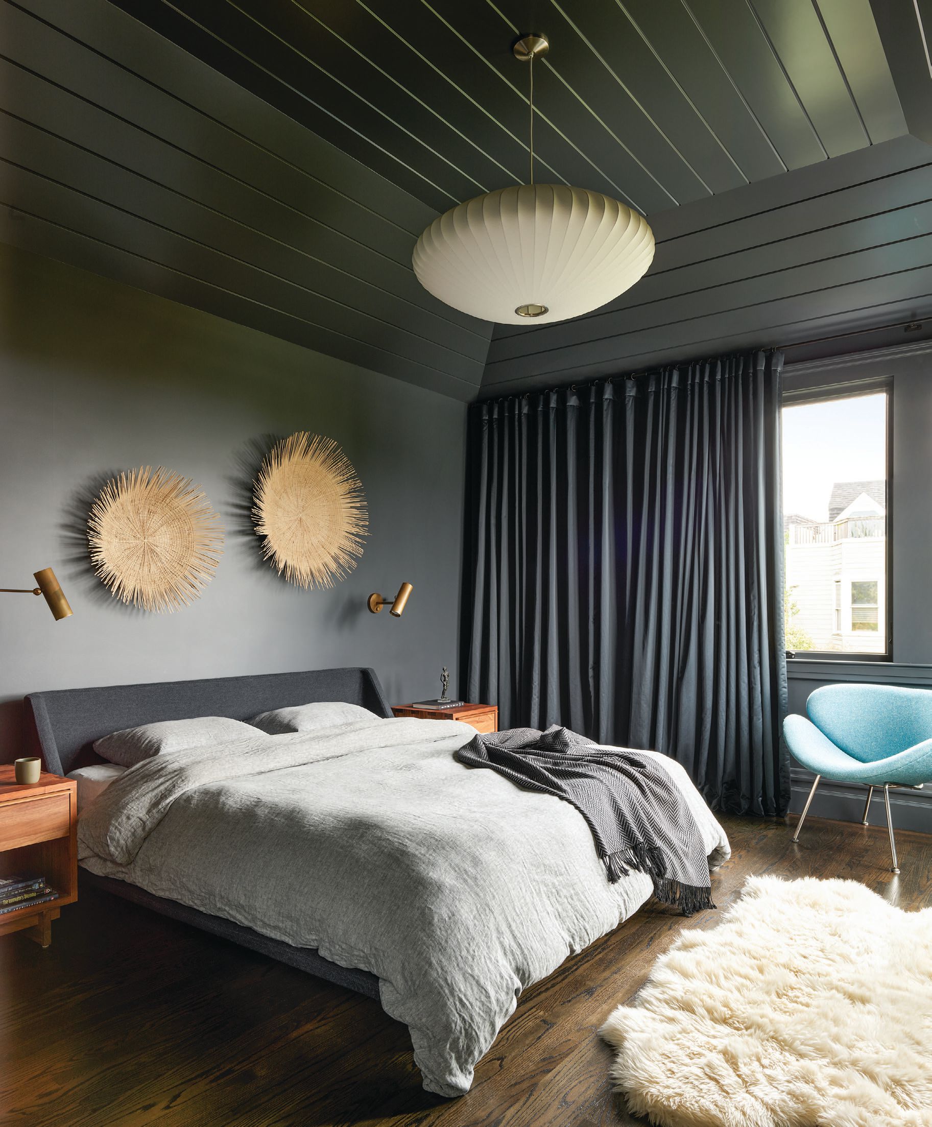 The cozy primary suite features a bed from Blu Dot. PHOTOGRAPHED BY MATTHEW MILLMAN