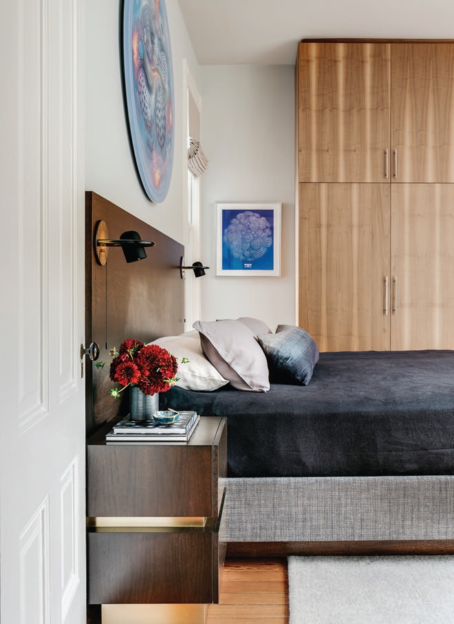 The primary bedroom houses a custom-designed-by-Kopman bed frame, sconces by Allied Maker, nightstands from Lawson-Fenning and artwork by Mars-1. PHOTOGRAPH BY CHRISTOPHER STARK