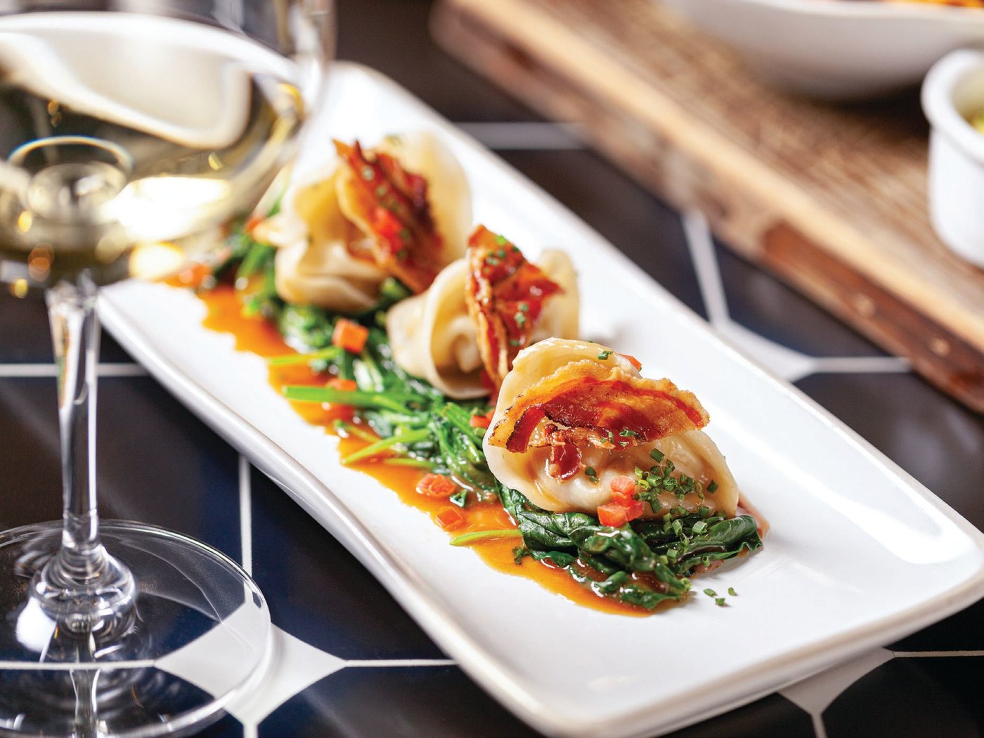 Pork belly pot stickers at the revitalized Willi’s Wine Bar PHOTO COURTESY OF THE BRANS