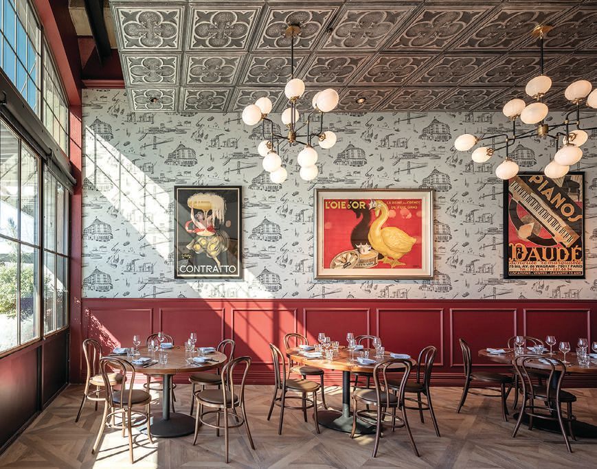 The light-filled dining room at Left Bank Brasserie, which is new in Oakland PHOTO BY ERIC RORER