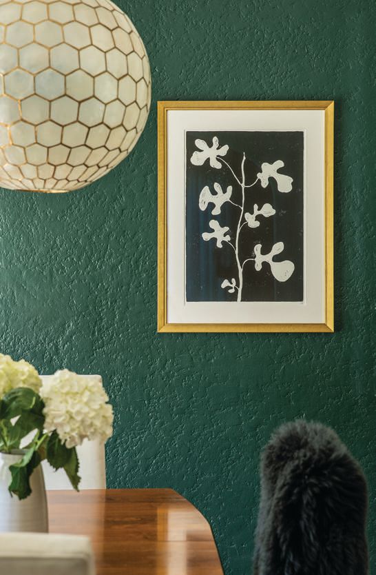 Find Nature “The wall color is Hunter Green from Benjamin Moore—it brings [natural hues] into any space,” says Palmer. “For feng shui, a dining room in green is lucky and healing; it’s also the center of the chakra for love. The honeycomb chandelier is from Serena and Lily. Round shapes are the most friendly, and this one feels light and gives off a warm glow, making everyone who sits at the table beautiful. The Hugo Guinness handblocked flower print is framed in rich gold by Walter Adams downtown—florals deliver good vibes and healthy energy to your home.” Benjamin Moore Hunter Green paint, benjaminmoore.com; Serena and Lily honeycomb chandelier, 3457 Sacramento St., serenaandlily.com; Hugo Guinness art, John Derian, johnderian.com; Cavallini frame, Walter Adams Framing, 355 Presidio Ave., walteradamsframing.com, cavallini.com. PHOTO BY THOMAS KUOH