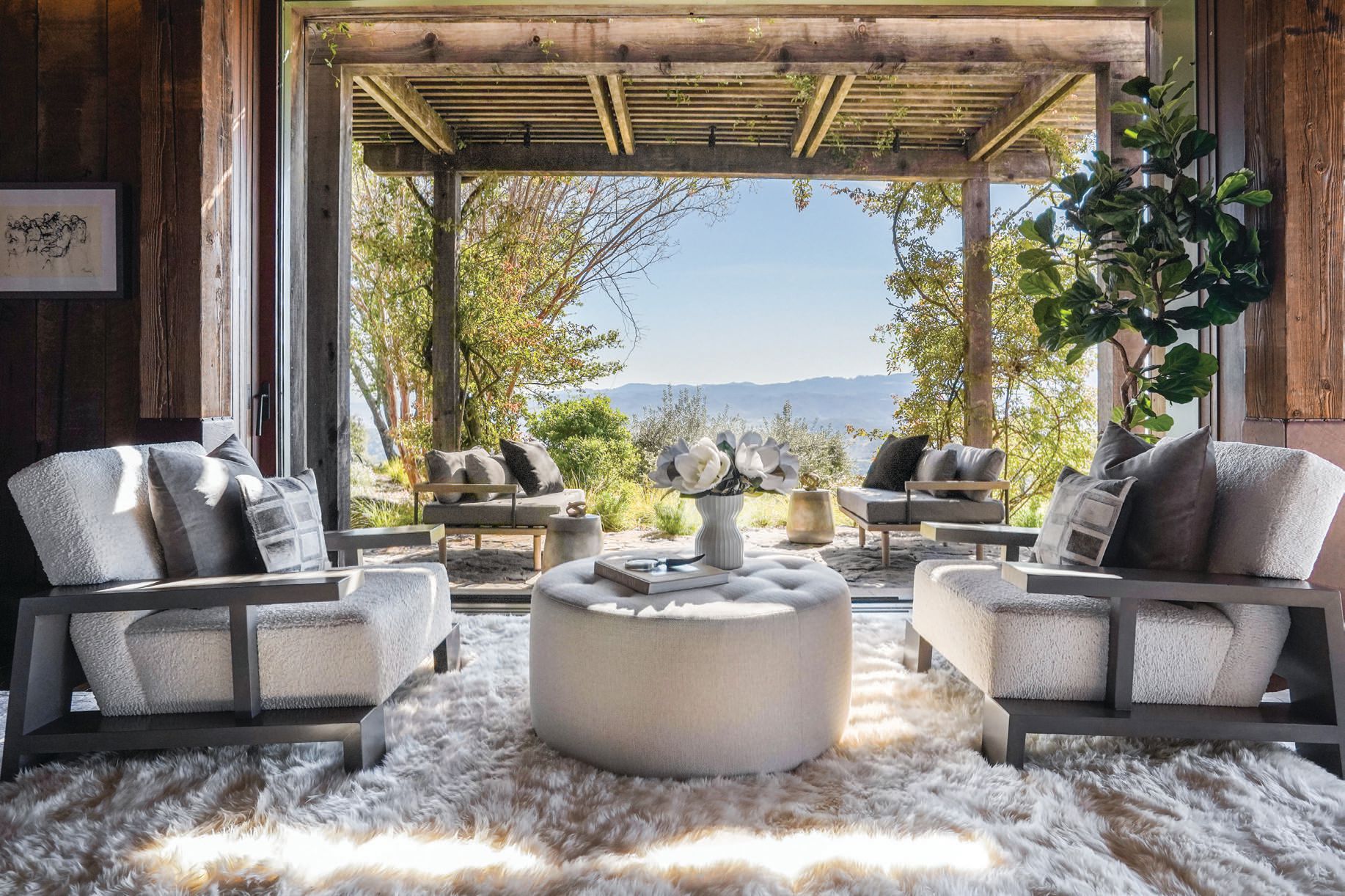 Plush carpeting, cozy environs and jaw-dropping views complete this indoor-outdoor lounge space. PHOTO BY CAROLINE PEEL AND AERIAL CANVAS