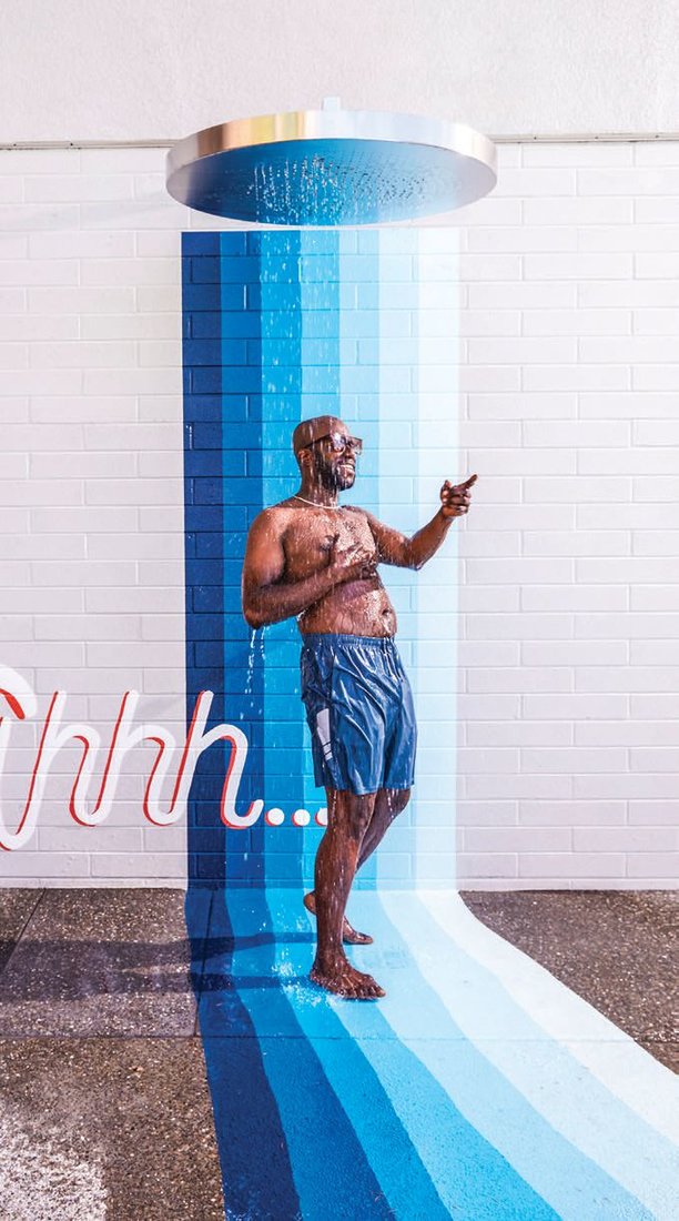 This Truth to Paper mural flows from the wall to the ground, as if flowing directly into the pool that’s in front of it. PHOTO BY: KATIE NEWBURN