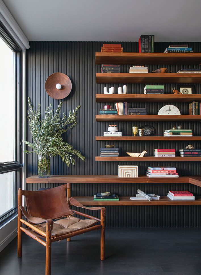 Located right off the dining room, the office, decked out with a custom desk and shelving by Bermosk Woodworks, is decidedly dramatic; PHOTOGRAPHED BY BESS FRIDAY