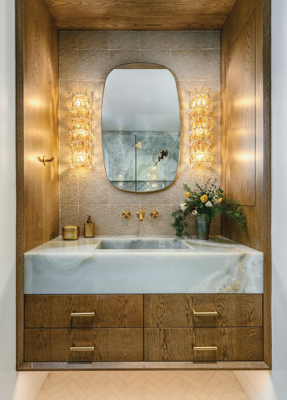 Stone and wood work in accord in a guest bathroom. PHOTOGRAPHED BY CHRISTOPHER STARK