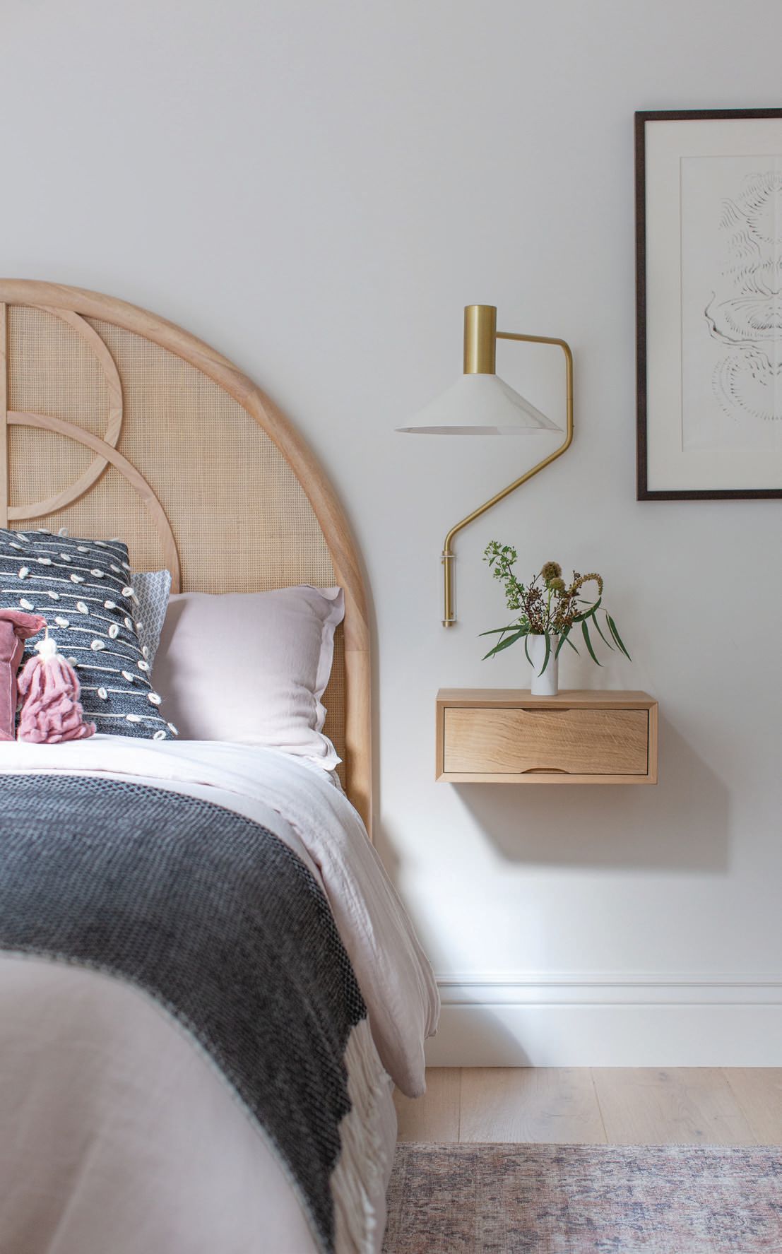 The stunning arch bed from Crate & Barrel is perfectly complemented with a structural Etsy nightstand atop a custom desk built-in. PHOTOGRAPHED BY BRAD KNIPSTEIN