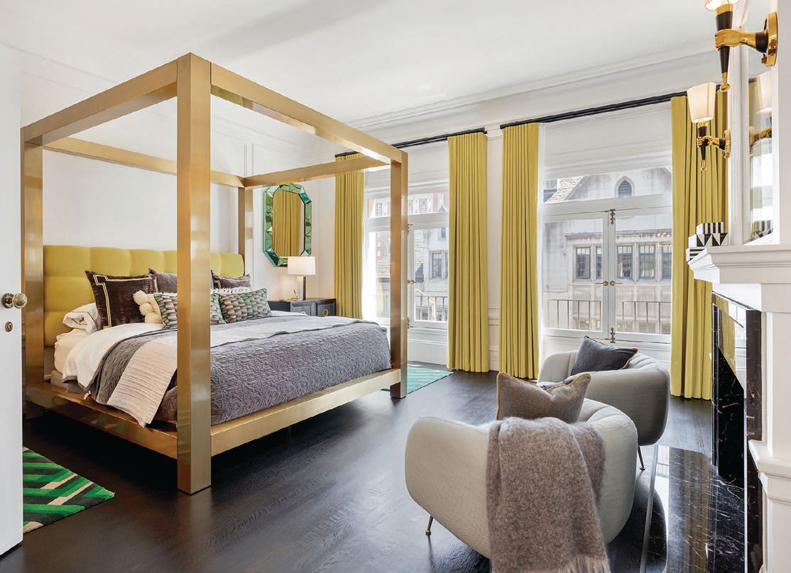 A stunning gold bed frame stars in the bedroom of the Sacramento Street abode. SACRAMENTO STREET PHOTO BY OPEN HOMES PHOTOGRAPHY