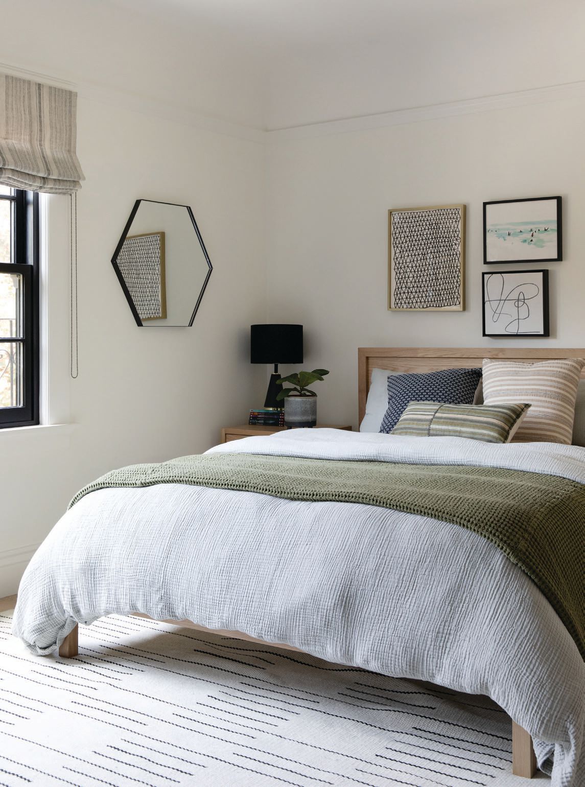 The boy’s room plays with pattern on pattern and textured luxury linen bedding